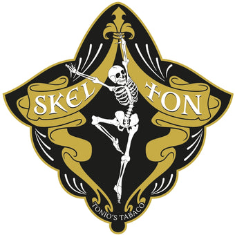 SkelTon Zigarrenlogo mit tanzendem Skelett in Gold und Schwarz